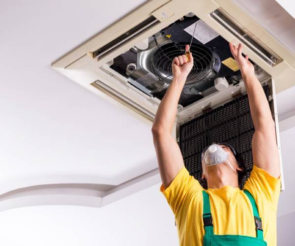 Technician performing maintenance in a Tennessee Home