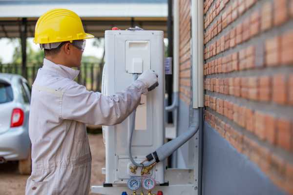 H V A C Technician performing a residential tuneup