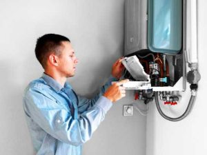 Frog Air Technician performing maintenance on A Tennessee Residential heater