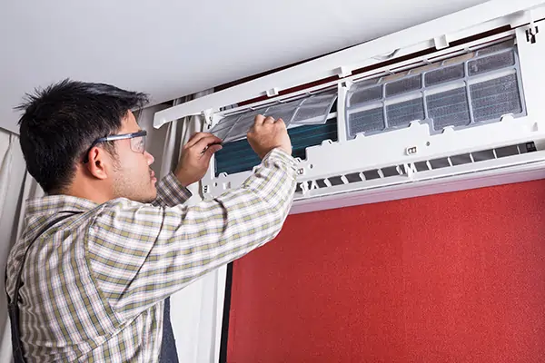 technician installing residential HVAC unit